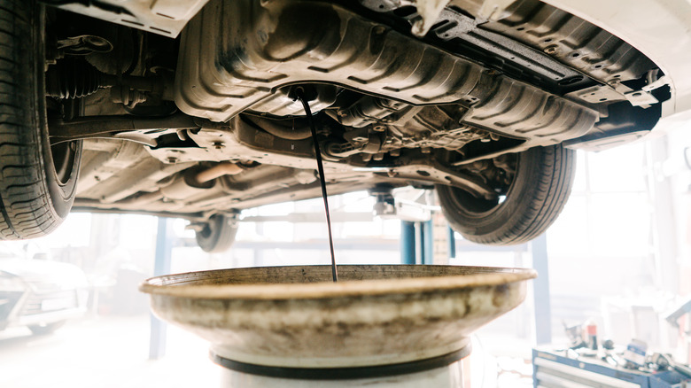 Draining used engine oil from a car engine