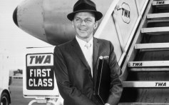(Original Caption) 9/27/1961-New York, NY: Singer-actor Frank Sinatra is shown boarding a TWA SuperJet back to Los Angeles after spending a few days in the East as a guest of President Kennedy.
