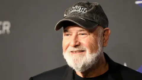 Getty Images Hollywood actor and director Rob Reiner wearing a black cap and black jacket.